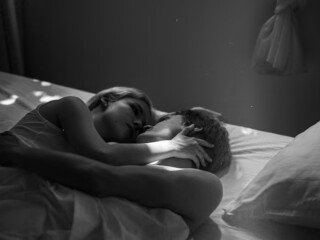 high-angle-cute-couple-laying-bed_52683-98023