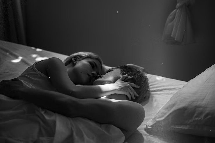 high-angle-cute-couple-laying-bed_52683-98023-2